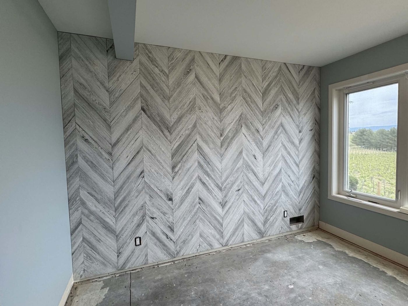 Chevron-pattern plank feature wall
